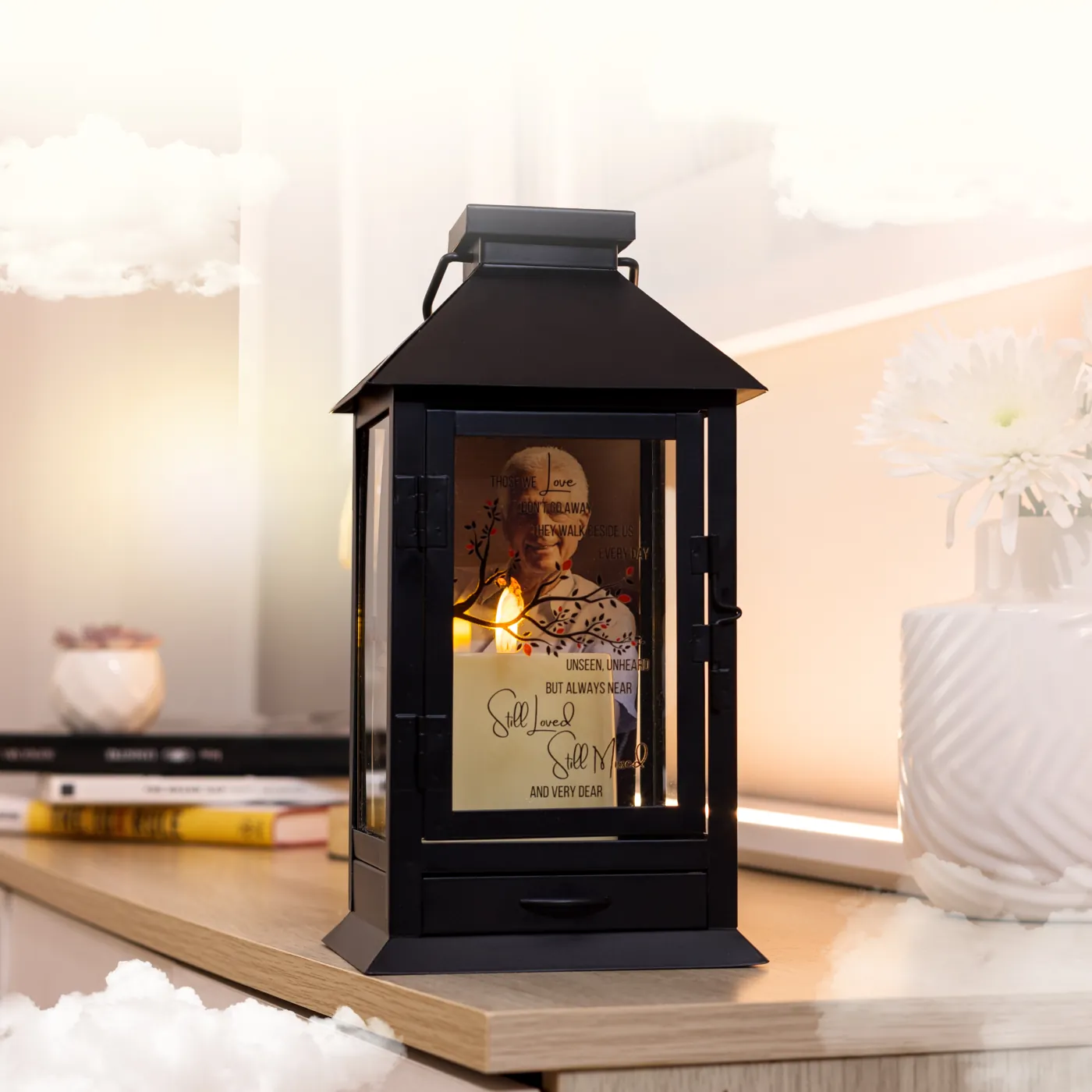 The black metal lantern lit on a shelf