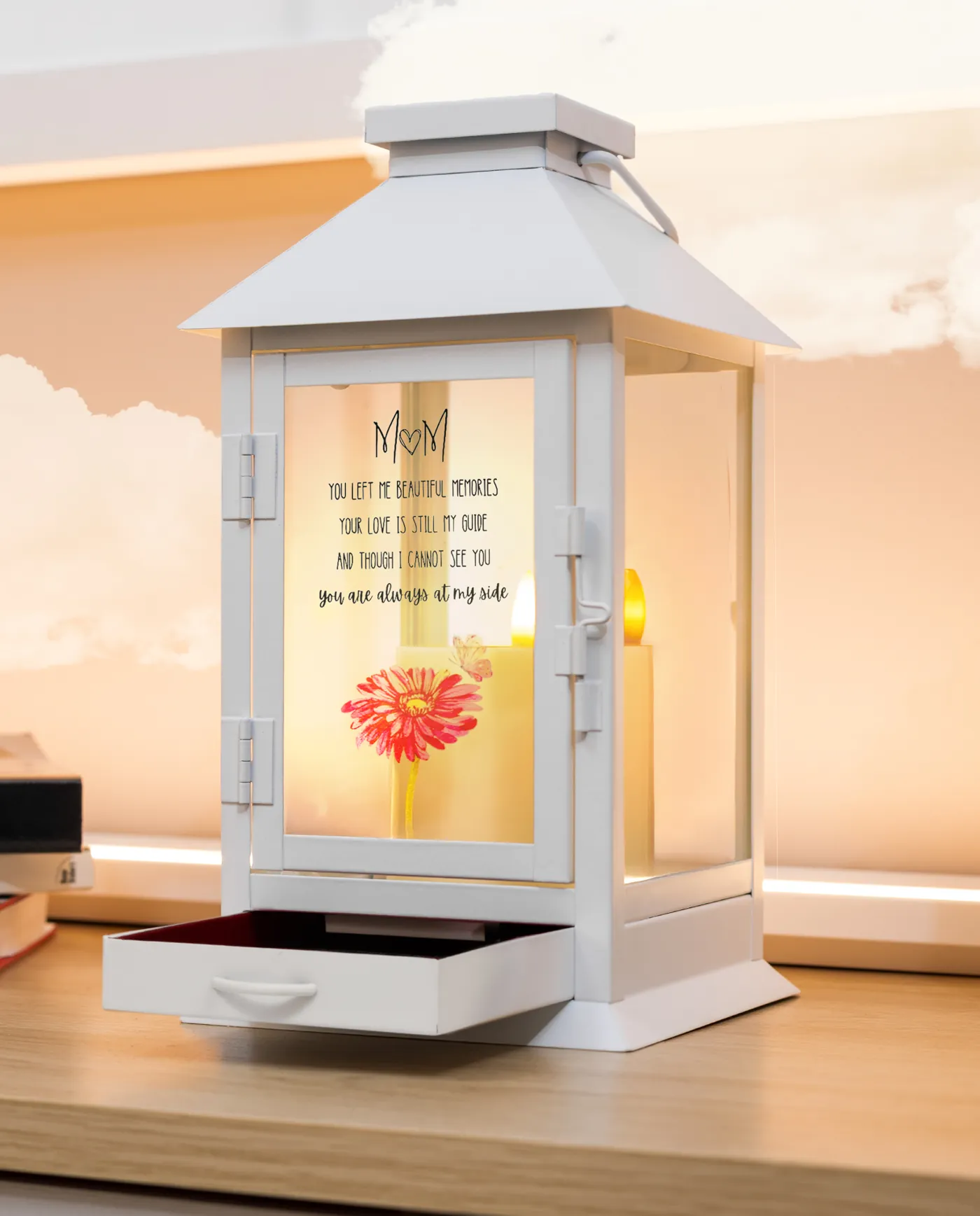 The white metal lantern, lit, with the Mom design