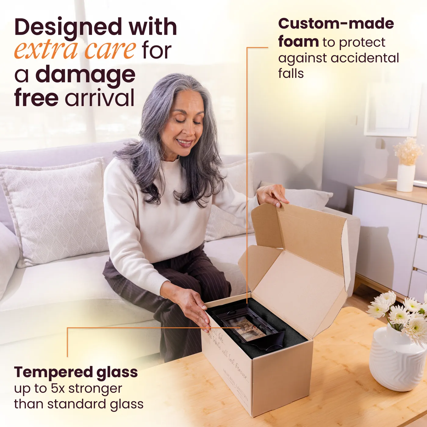 A woman sitting beside a lit black lantern